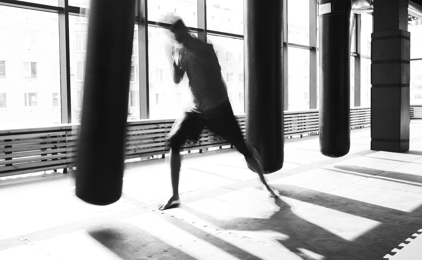Heavy bags by the windows at the back of the room