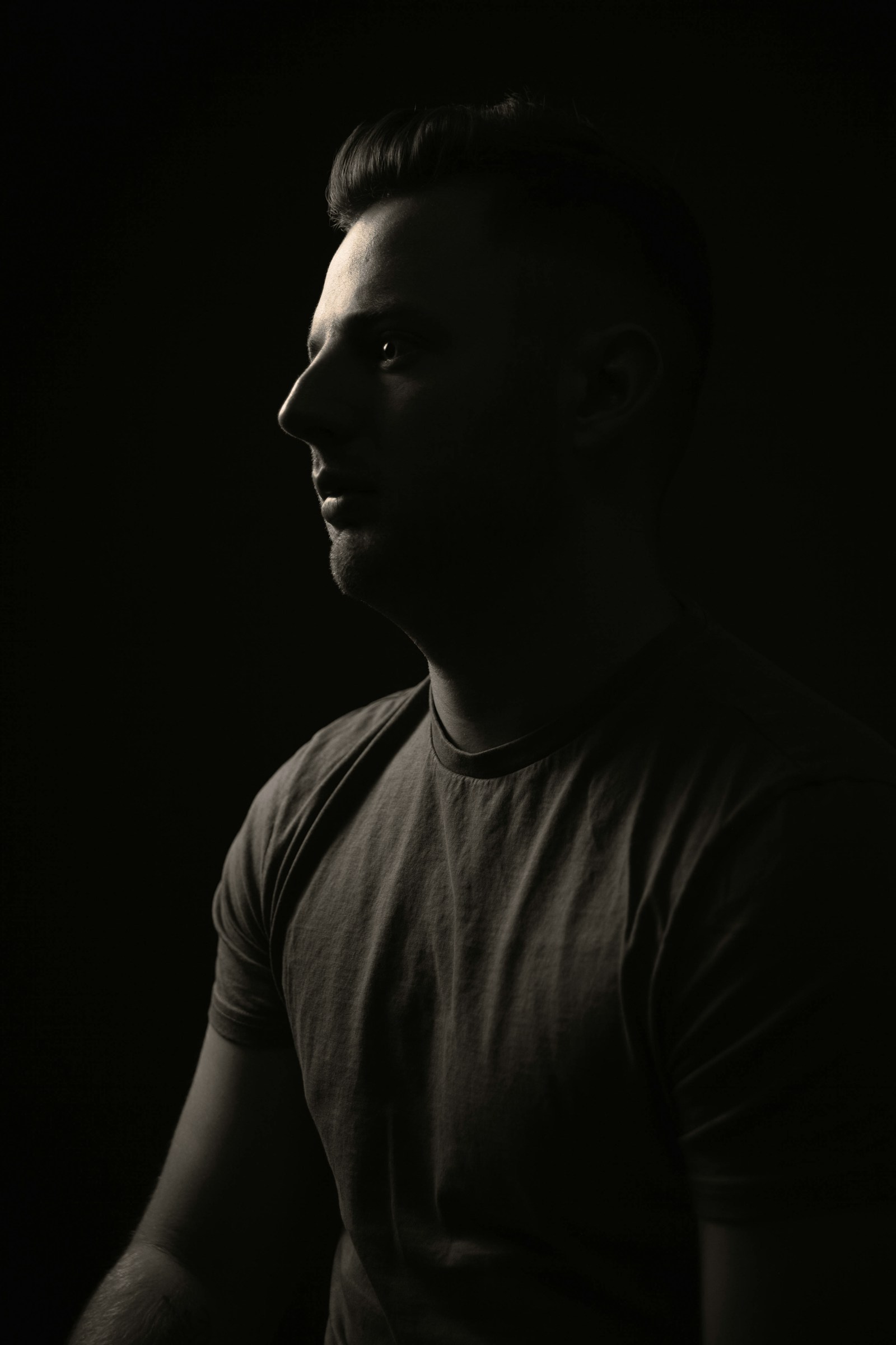Tomas Brandt in profile, in a plain T-shirt