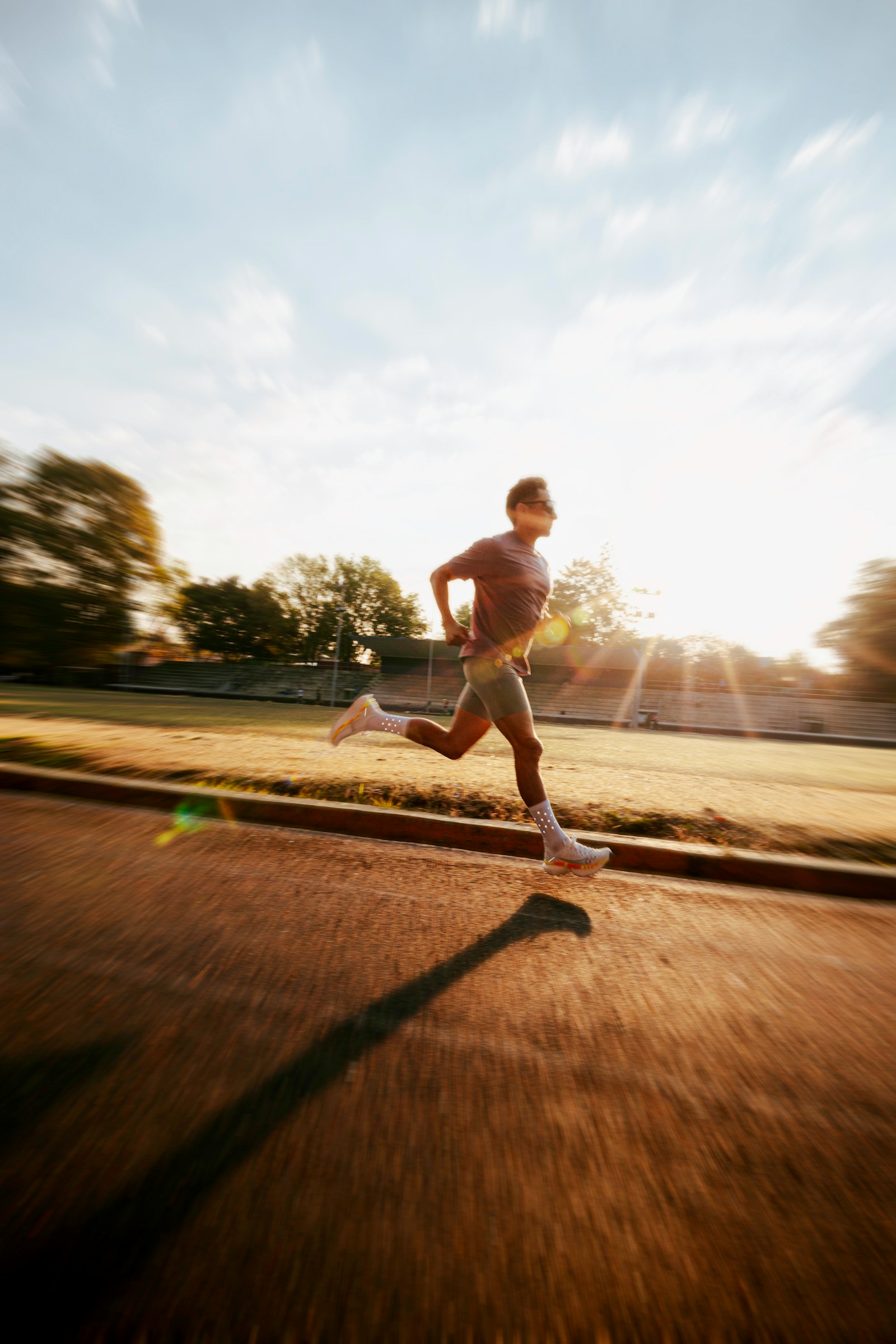 Runner on a track at sunrise